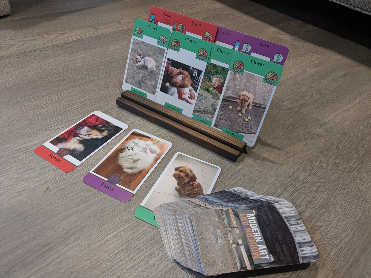 Several dog cards are on display next to a deck.