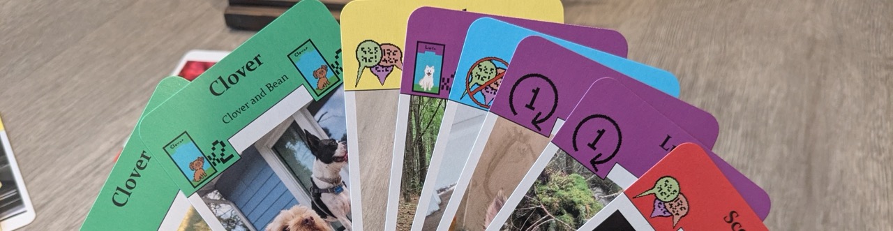 A banner image featuring a closeup of a hand of custom cards.