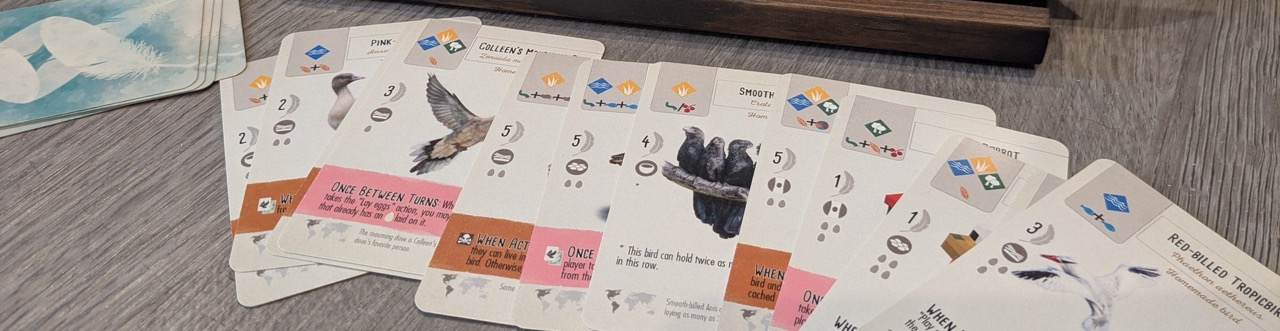 A banner image featuring several custom cards fanned out.